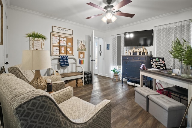 living area with crown molding, wood finished floors, and ceiling fan