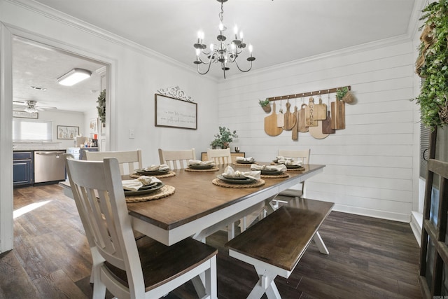 dining space with ornamental molding, ceiling fan with notable chandelier, and dark wood-style flooring