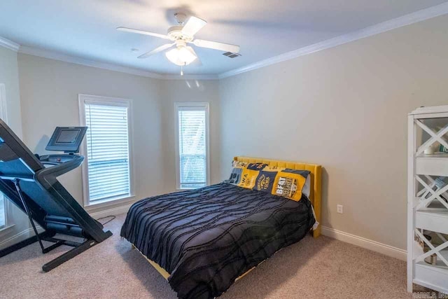 carpeted bedroom featuring ceiling fan and ornamental molding