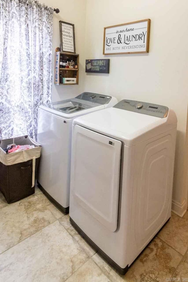 laundry room with washing machine and clothes dryer