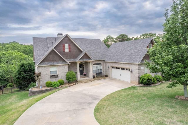 craftsman inspired home with a front yard and a garage