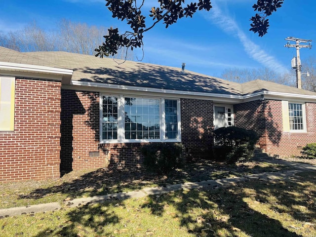 view of property exterior featuring a yard