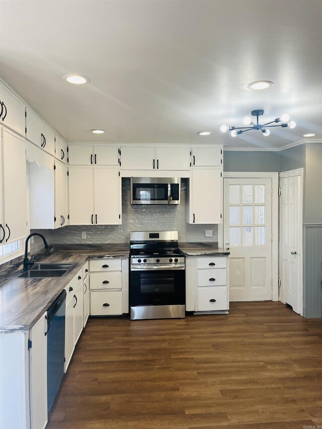 kitchen with white cabinets, stainless steel appliances, dark wood-type flooring, and sink