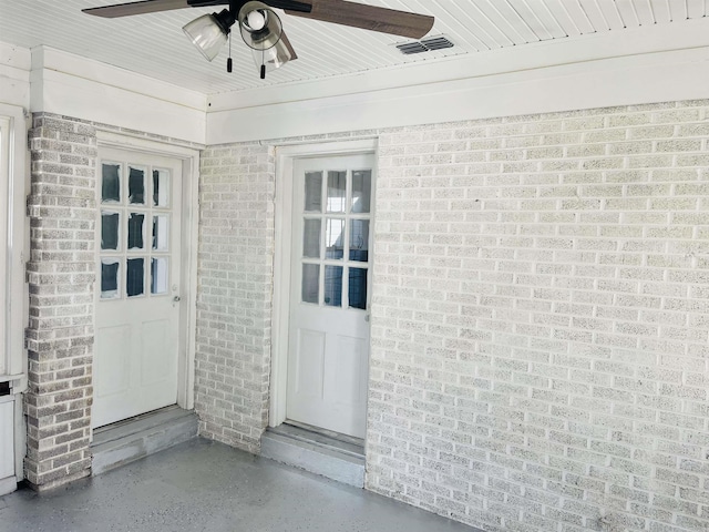 property entrance with ceiling fan