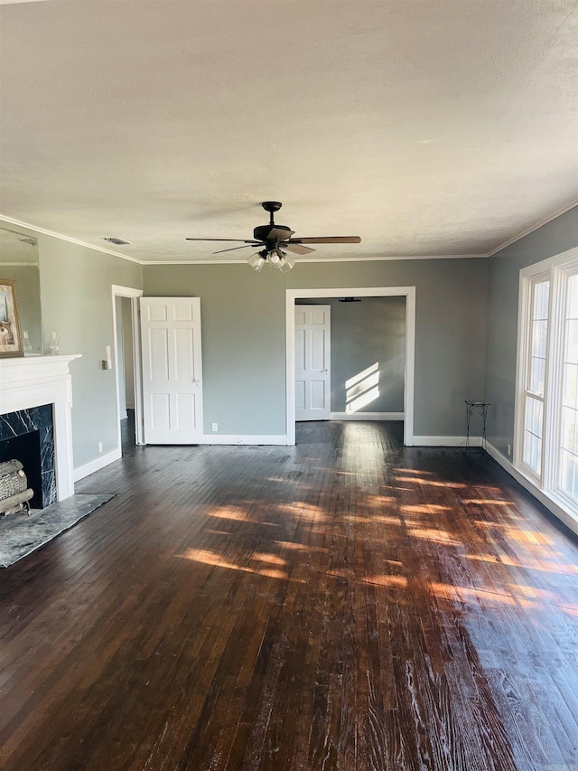 unfurnished living room with ceiling fan, dark hardwood / wood-style flooring, and a fireplace