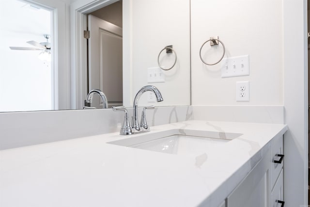 bathroom featuring ceiling fan and vanity