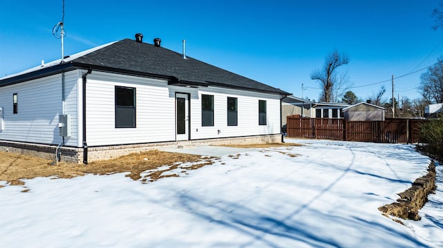 view of snow covered house