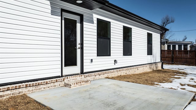 view of side of property with a patio