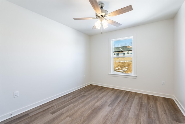 unfurnished room with wood-type flooring and ceiling fan