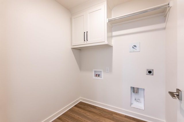 washroom featuring electric dryer hookup, dark hardwood / wood-style floors, cabinets, and hookup for a washing machine