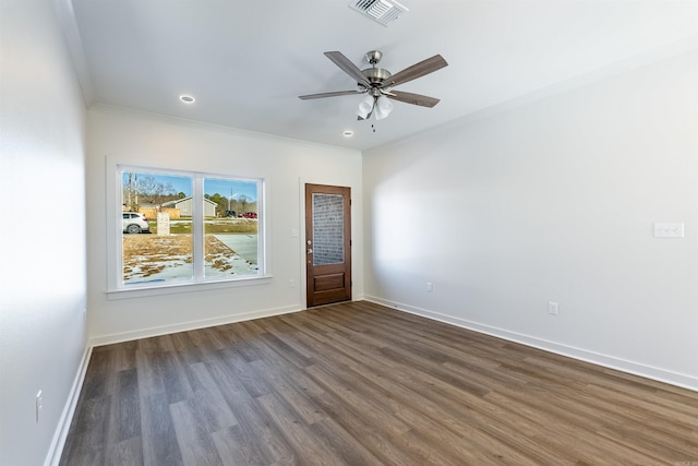 unfurnished room with dark hardwood / wood-style floors, ceiling fan, and ornamental molding