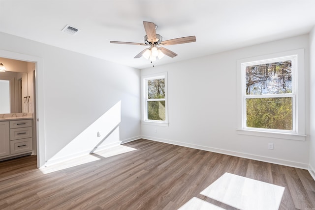 empty room with light hardwood / wood-style floors and ceiling fan