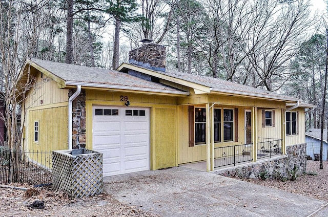 single story home with a garage and a porch