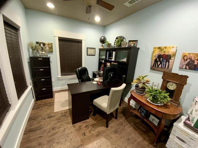 office area featuring dark hardwood / wood-style floors and ceiling fan