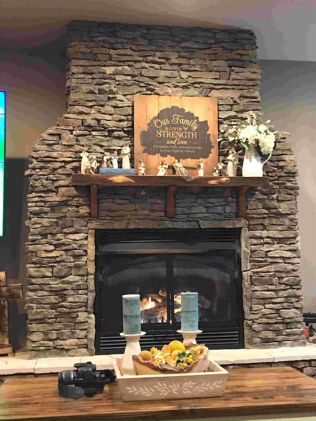 room details featuring a stone fireplace