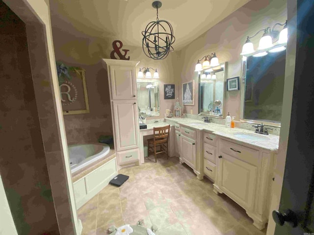 bathroom featuring tile patterned floors, vanity, a bath, and an inviting chandelier