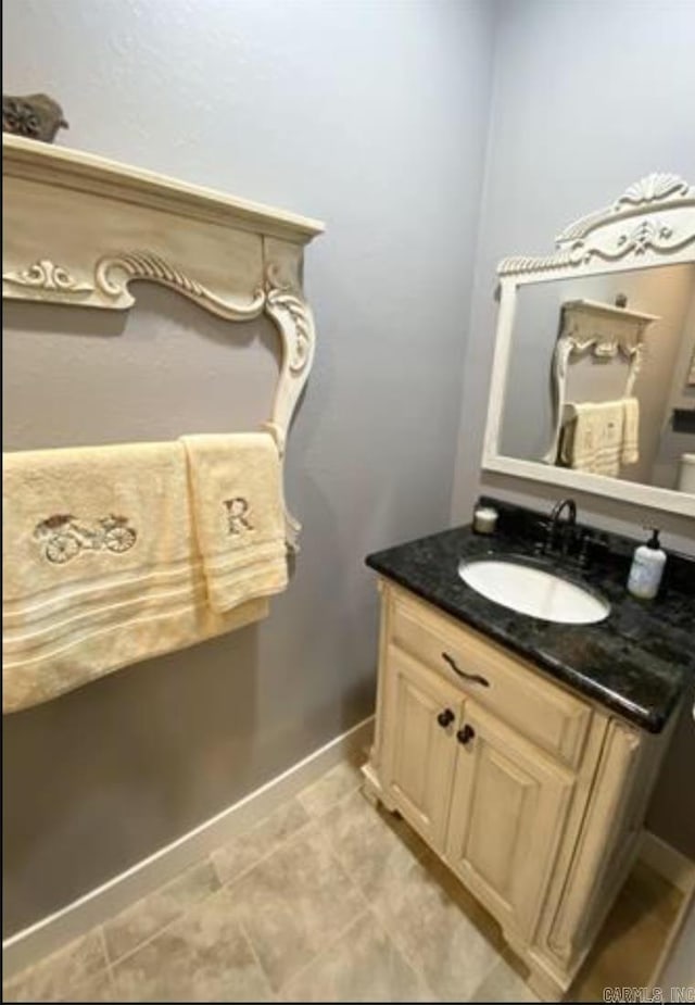 bathroom with tile patterned flooring and vanity