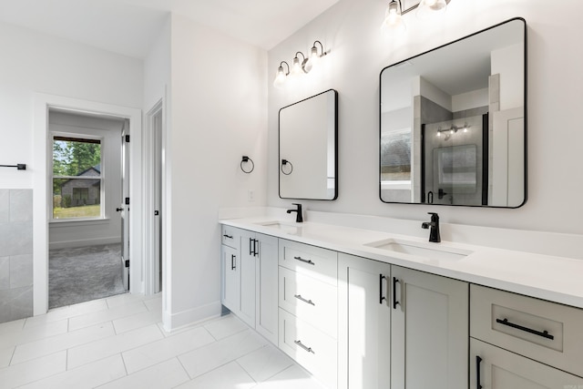 bathroom featuring tile patterned flooring and vanity