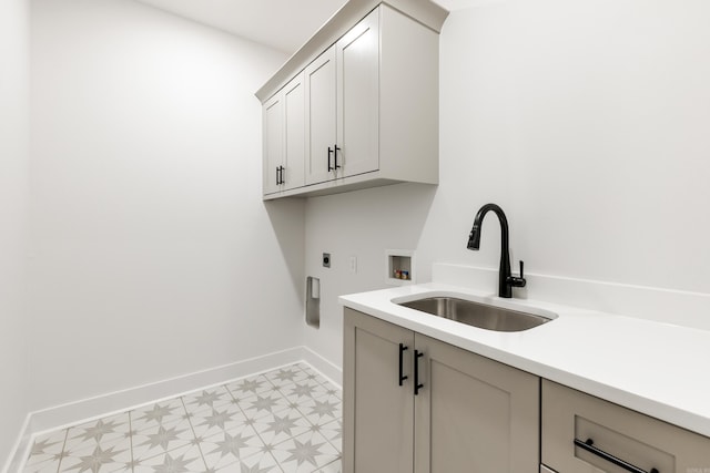 laundry area featuring electric dryer hookup, cabinets, sink, and hookup for a washing machine