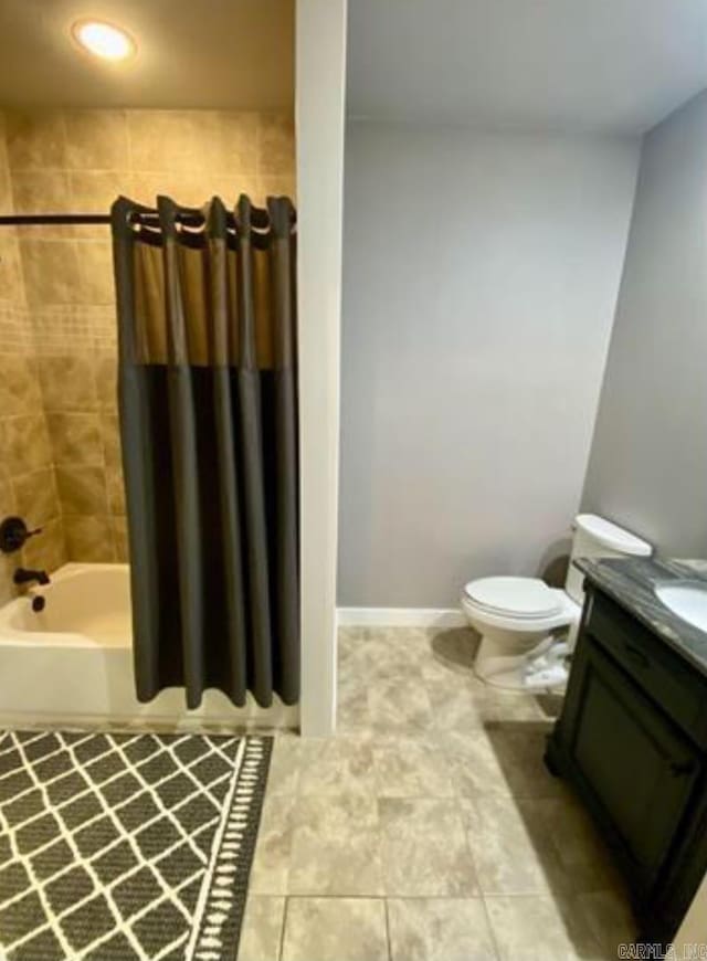 full bathroom featuring tile patterned floors, vanity, shower / bath combination with curtain, and toilet