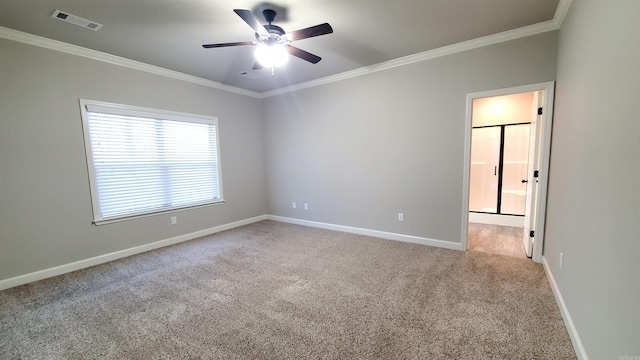 empty room with carpet, ceiling fan, and ornamental molding