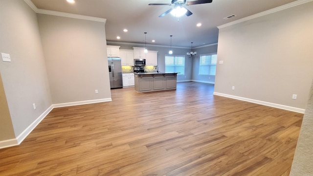 unfurnished living room with crown molding, light hardwood / wood-style flooring, and ceiling fan with notable chandelier