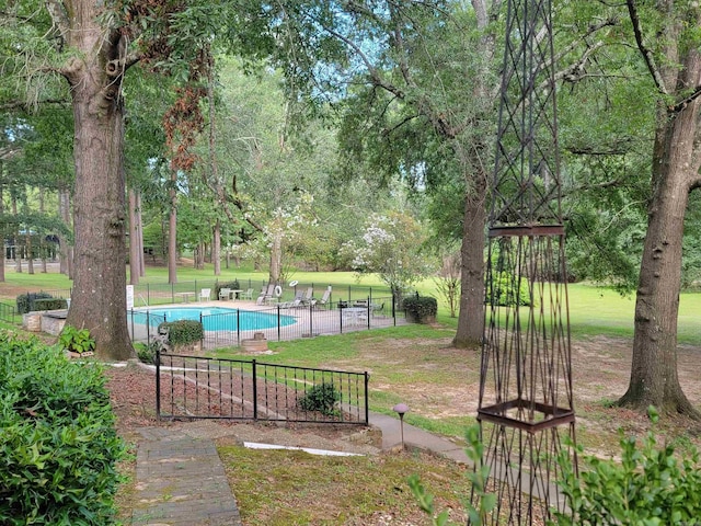 view of yard featuring a community pool