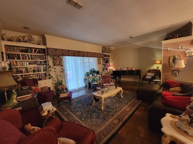 living room featuring crown molding, wood-type flooring, and a textured ceiling