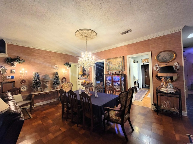 dining room featuring a textured ceiling and an inviting chandelier