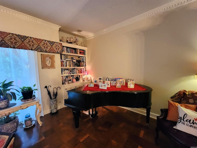 recreation room featuring a textured ceiling, dark hardwood / wood-style floors, and crown molding