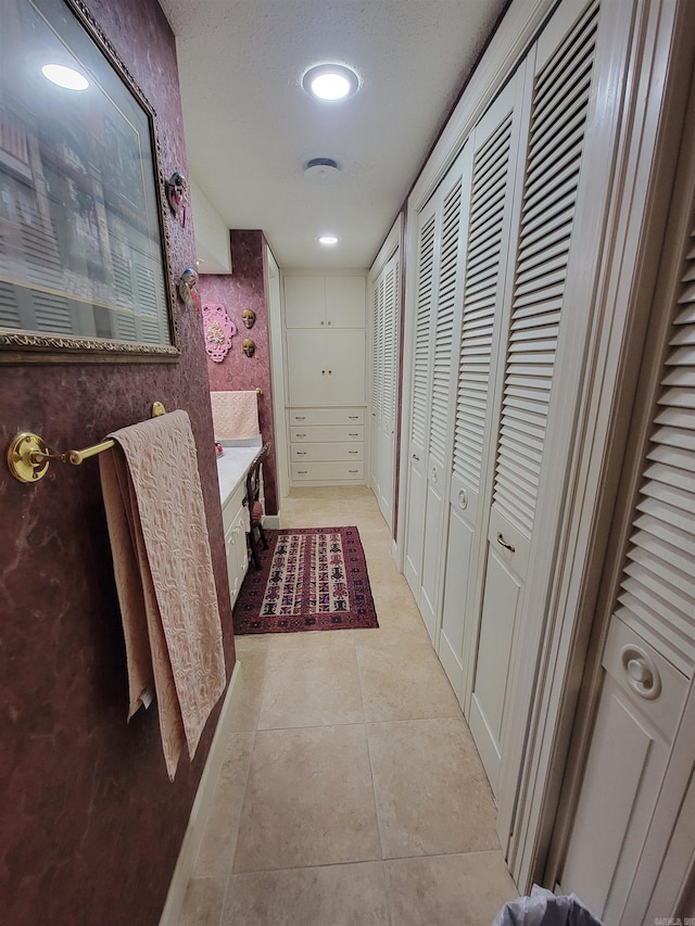 hallway featuring light tile patterned floors