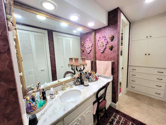 bathroom with tile patterned floors, vanity, and toilet