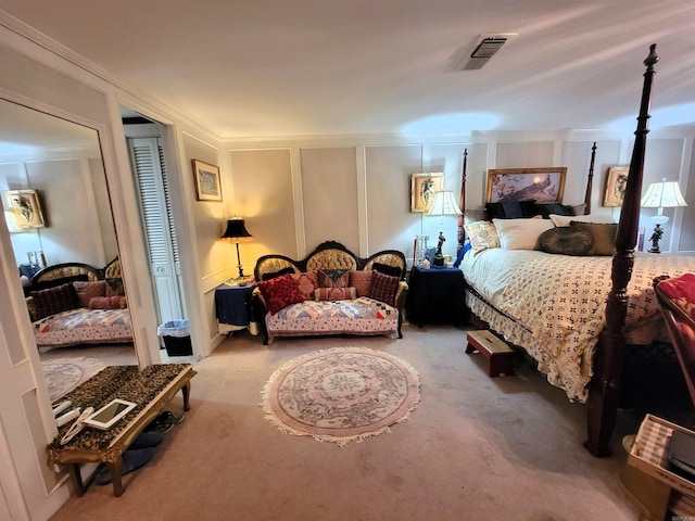 carpeted bedroom featuring ornamental molding