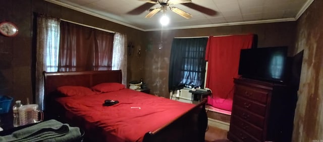 bedroom with ceiling fan and ornamental molding