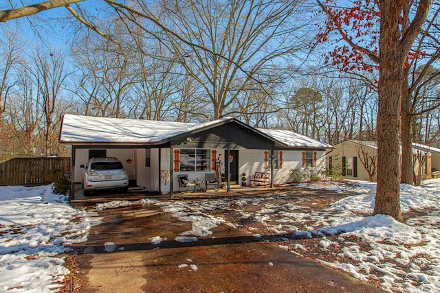 view of front of property featuring a carport