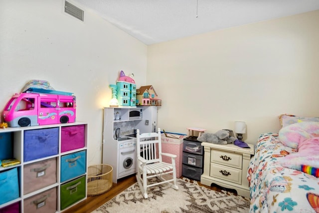 bedroom featuring hardwood / wood-style flooring