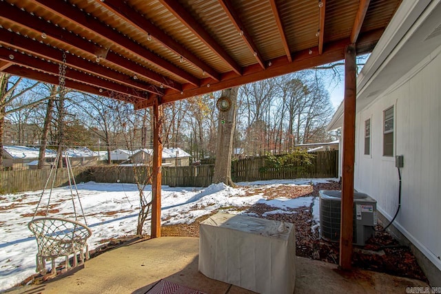 snow covered patio with central AC