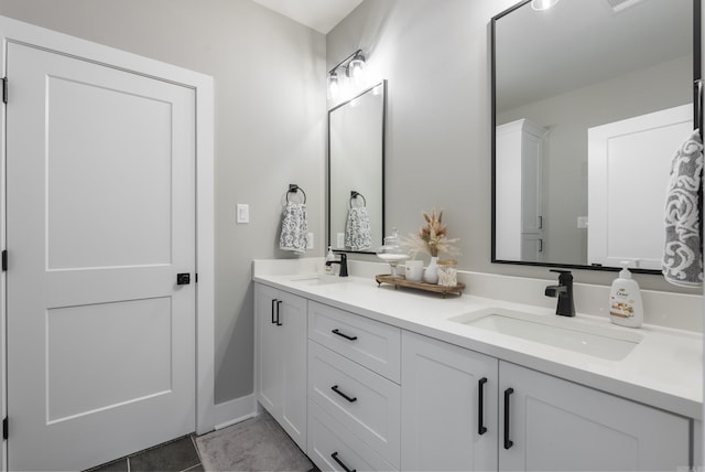 bathroom with tile patterned floors and vanity