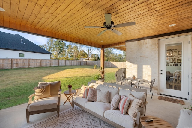 view of patio with an outdoor living space and ceiling fan