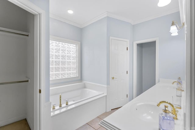 bathroom with a tub, crown molding, tile patterned flooring, and vanity