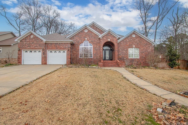 view of front facade with a front yard and a garage