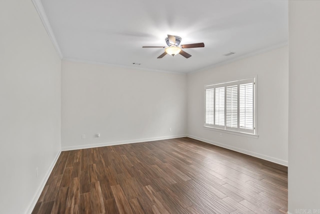 empty room featuring ceiling fan, dark hardwood / wood-style floors, and ornamental molding