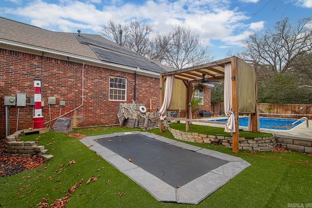 exterior space featuring a fenced in pool