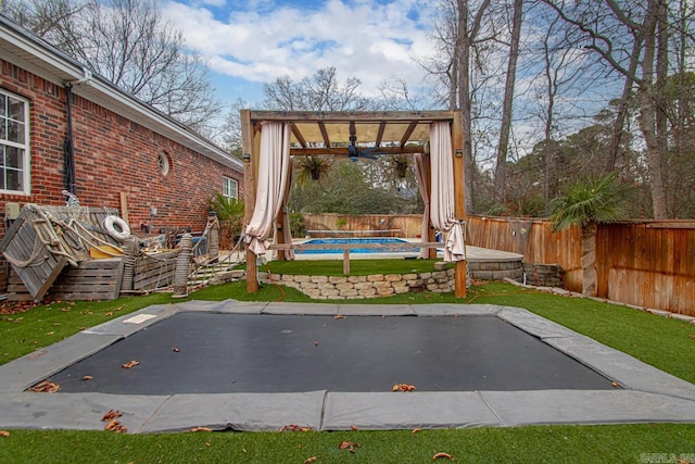 view of patio / terrace featuring a pergola and a covered pool