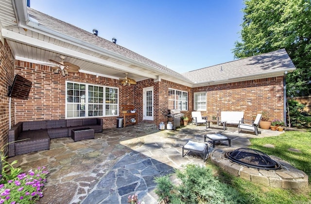 view of patio featuring ceiling fan, a grill, and an outdoor living space with a fire pit