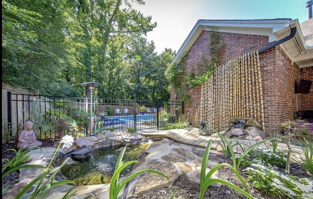 view of yard with a community pool