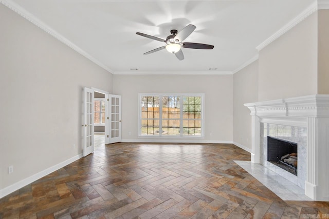 unfurnished living room featuring ceiling fan, a premium fireplace, crown molding, and dark parquet floors