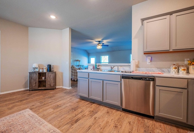 kitchen with dishwasher, gray cabinets, light hardwood / wood-style floors, and sink