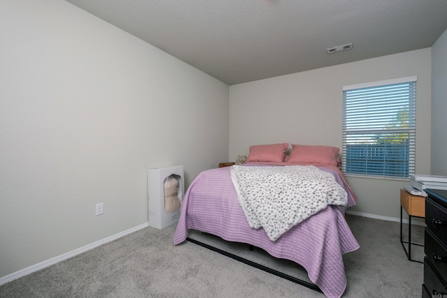 bedroom with light colored carpet