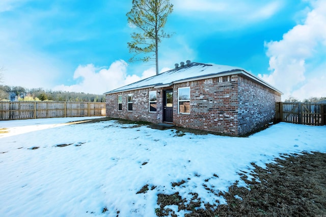 view of snow covered property